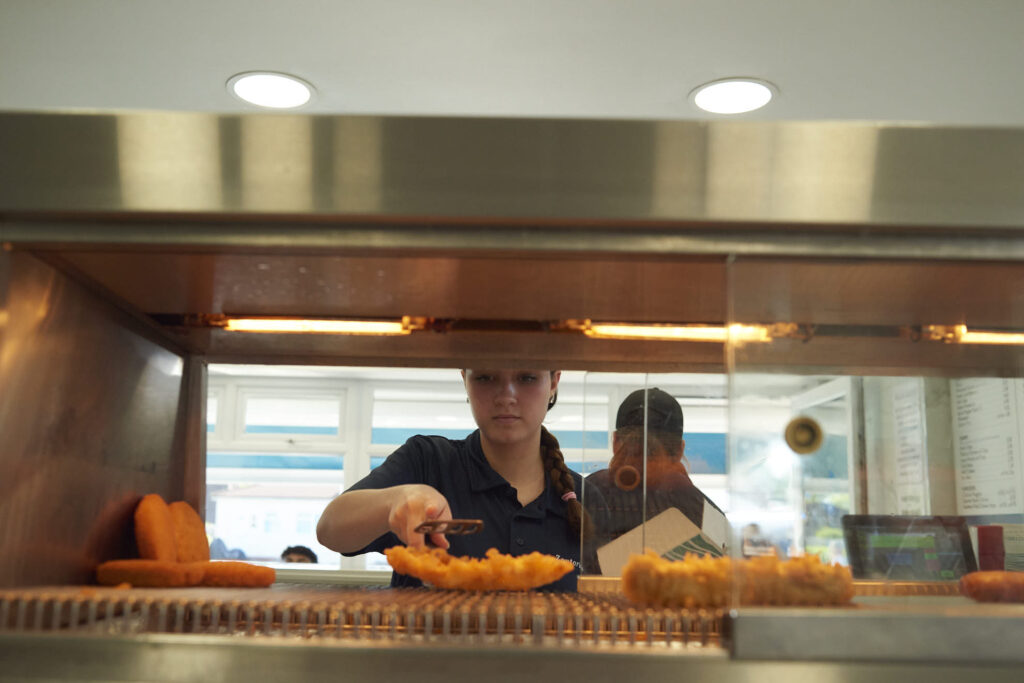 Staff serving at from Zoutorias Traditional Fish and Chip bar